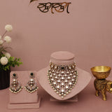 Jewelry set including necklace, earrings, and decorative items on a pink background with 'kumkum' branding.